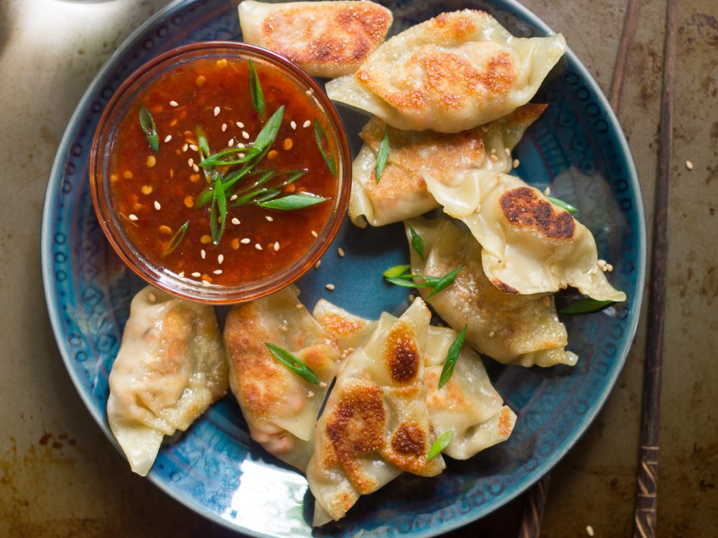 Close Up of a Plate of Tofu Dumplings with Sweet Chili Dipping Sauce