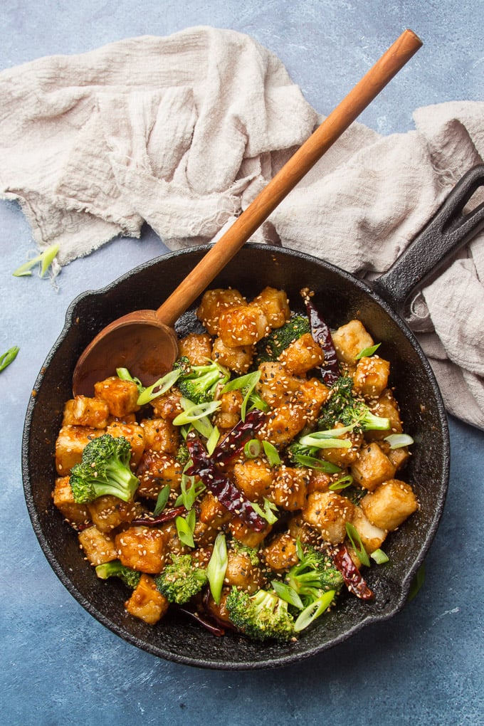 General Tso's Tofu in a Cast Iron Skillet with Serving Spoon