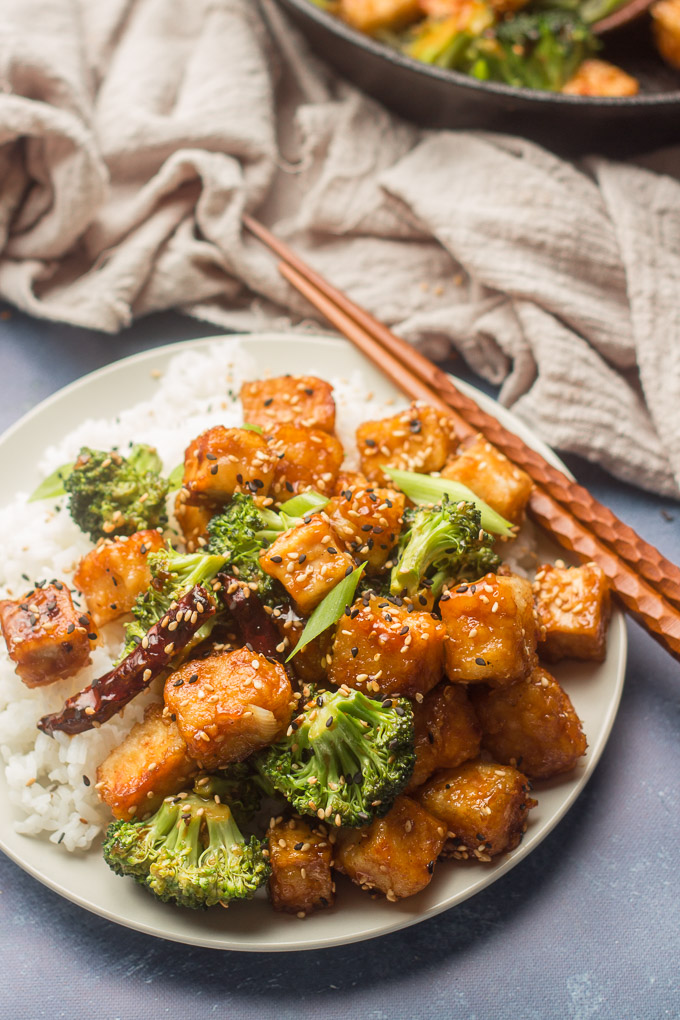 Plate of General Tso's Tofu with Chopsticks Perched on the Edge