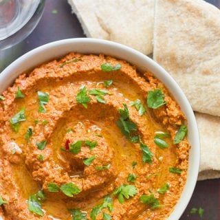 A Bowl of Muhammara Topped with Fresh Parsley