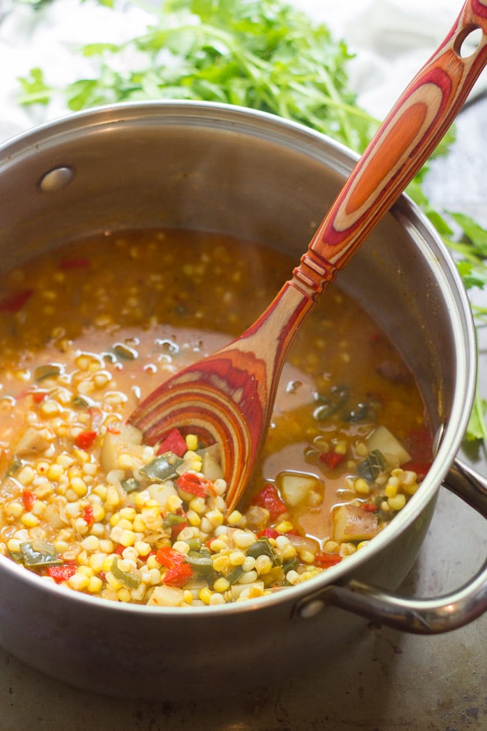 Corn Chowder in a Large Pot with Spoon