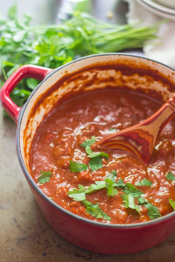 Pot of Spicy Tomato Cream Sauce with Wooden Spoon