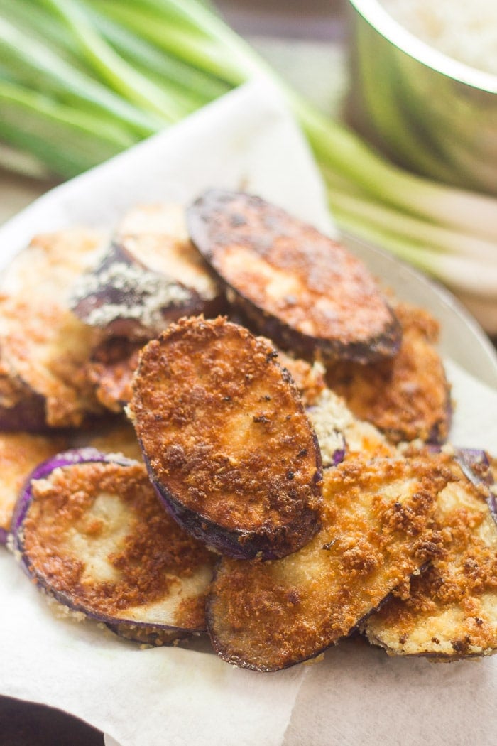 Fried Eggplant Slices on a Paper Towel-Lined Plate