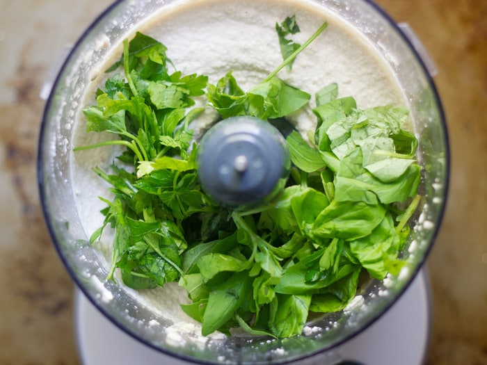 Cashew Cream Sauce and Herbs in a Food Processor Bowl