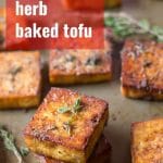 Lemon & Herb Baked Tofu on a Baking Sheet with Text Overlay Reading "Lemon & Herb Baked Tofu"