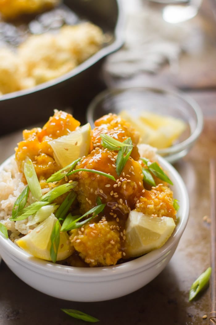 Sticky Lemon Cauliflower in a Bowl Topped with Scallions