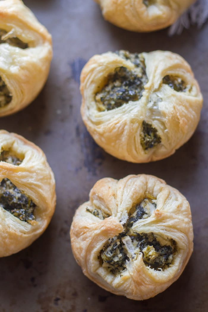 Close Up of Vegan Spinach Puffs on a Distressed Surface