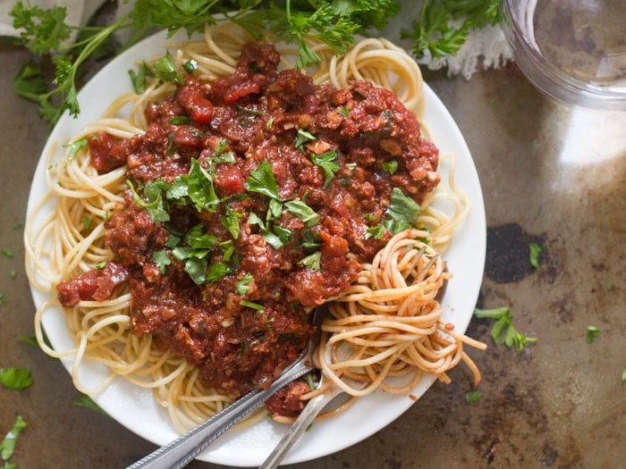 Plate of Spaghetti with Cauliflower Walnut Meat Sauce Topped with Fresh Parsley