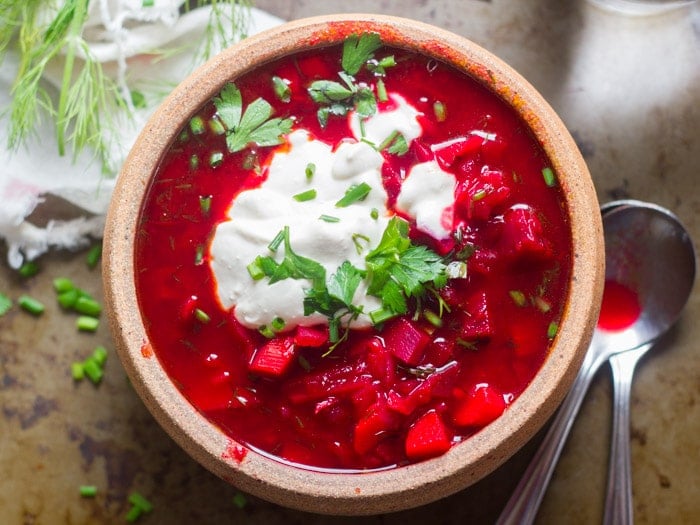 Vegan Borscht in a Bowl with Cashew Cream and Herbs