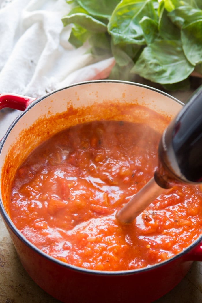 Hand Blender Blending Creamy Tomato Basil Gnocchi Soup in a Pot