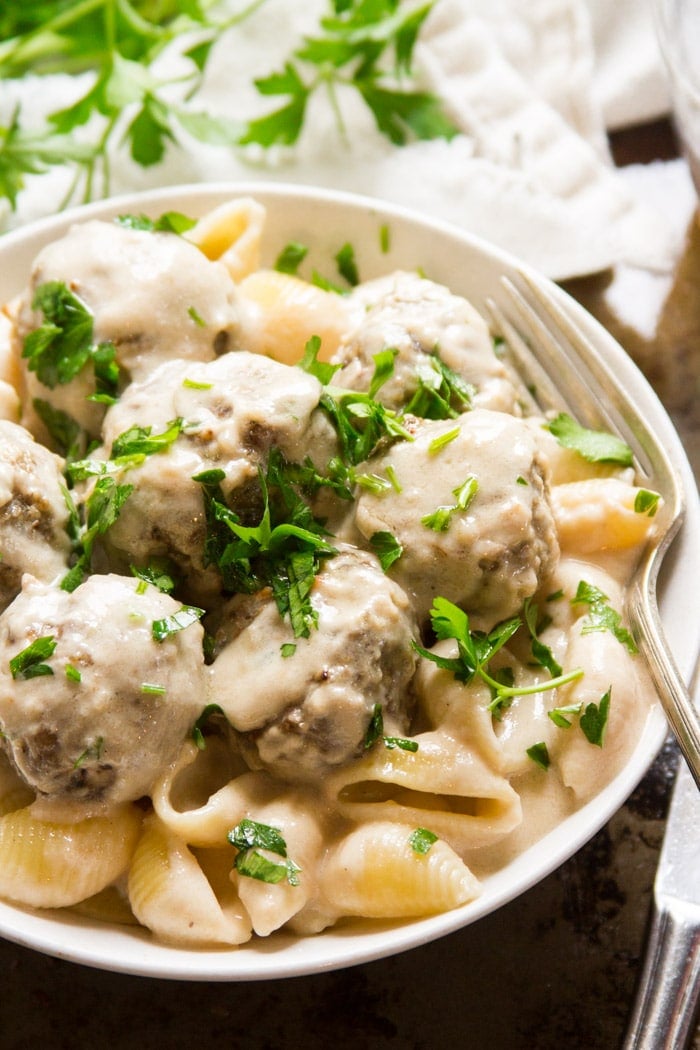 Vegan Swedish Meatballs with Cream Sauce over Noodles in a Bowl