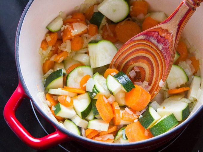 Carrots and Zucchini Simmering in Sauce to Make Vegan Pasta Primavera