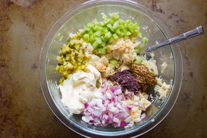 Glass Bowl Filled with Heart of Palm, Chickpeas, Vegan Mayo, Mustard, Celery and Relish for Making Vegan Tuna Salad