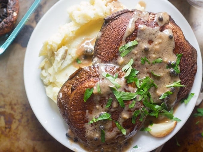 Overhead View of Whiskey Peppercorn Portobello Steak on a Plate with Mashed Potatoes and Parsley
