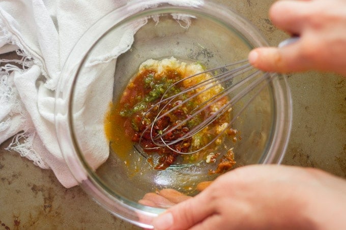 Hand Whisking Sauce in a Bowl for Chipotle and Lime Roasted Potatoes