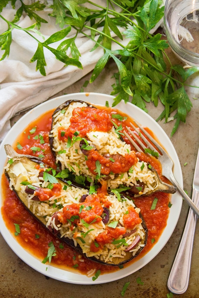 Overhead View of Mediterranean Stuffed Eggplant on a Plate with Fork