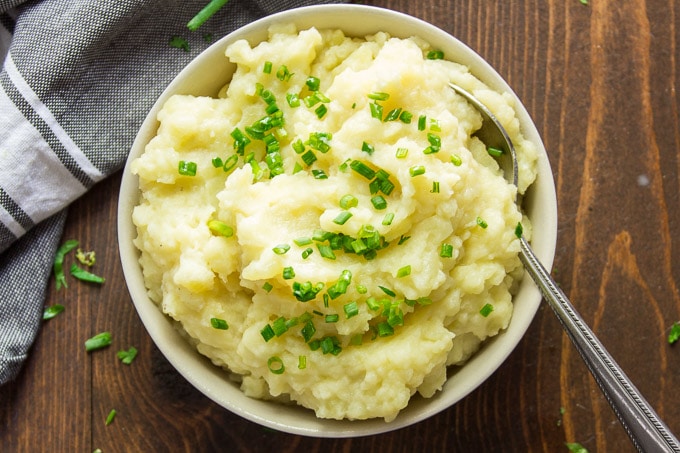 Overhead View of a Bowl of Truffled Mashed Potatoes Topped with Chives