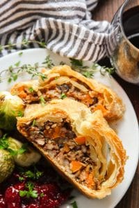 Close Up of Two Slices of Vegan Vegetable Wellington on a Plate