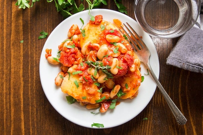 Overhead View of White Bean & Tomato Polenta Casserole on a Plate with Fork