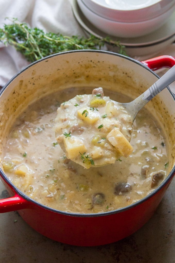 Ladle Scooping Vegan Clam Chowder from a Pot