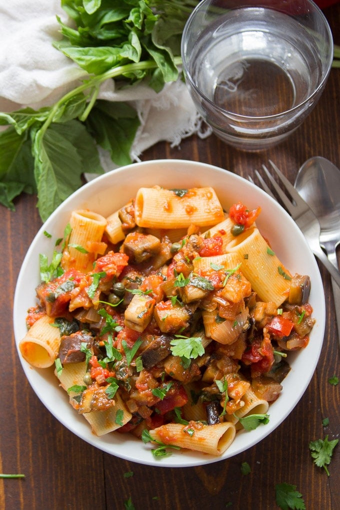 Spicy Eggplant Pasta in a Bowl Topped with Fresh Basil & Parsley