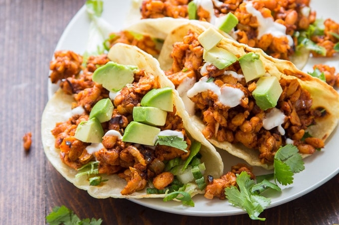 Close Up of Chipotle Tempeh Tacos Topped with Diced Avocado
