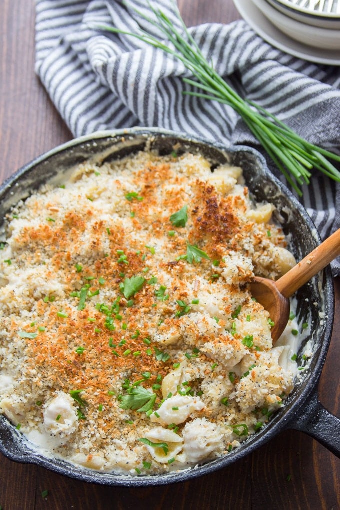 Vegan Everything Bagel Mac and Cheese in a Skillet with Wooden Spoon