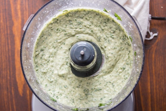 White Bean Basil Hummus in a Food Processor Bowl for Vegan Green Goddess Pizza