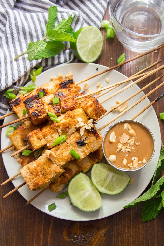 Tofu Satay on a Plate with Water Glass and Striped Napkin