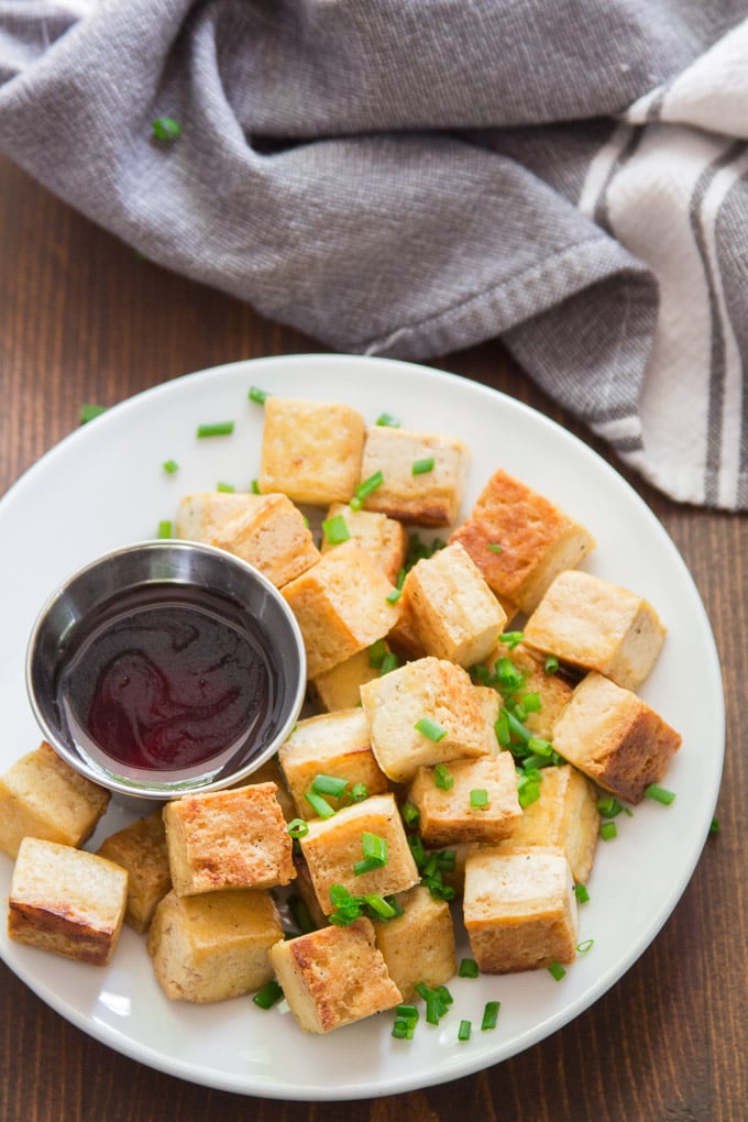 Crispy Salt & Vinegar Tofu on a Plate Topped with Chives