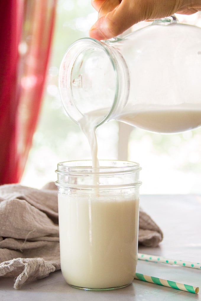 Almond Milk Being Poured into a Glass