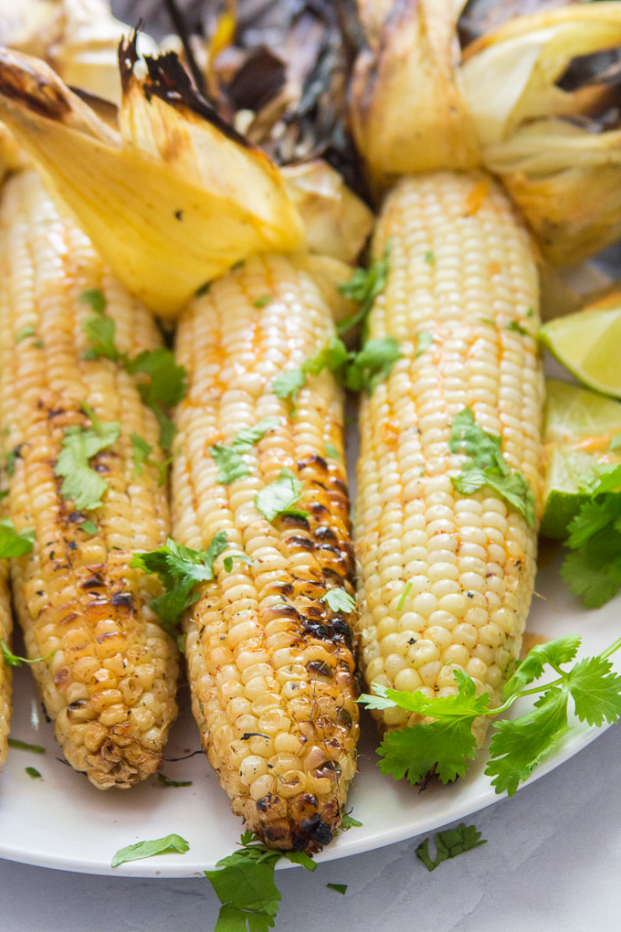 Three Ears of Mexican Grilled Corn on a Plate