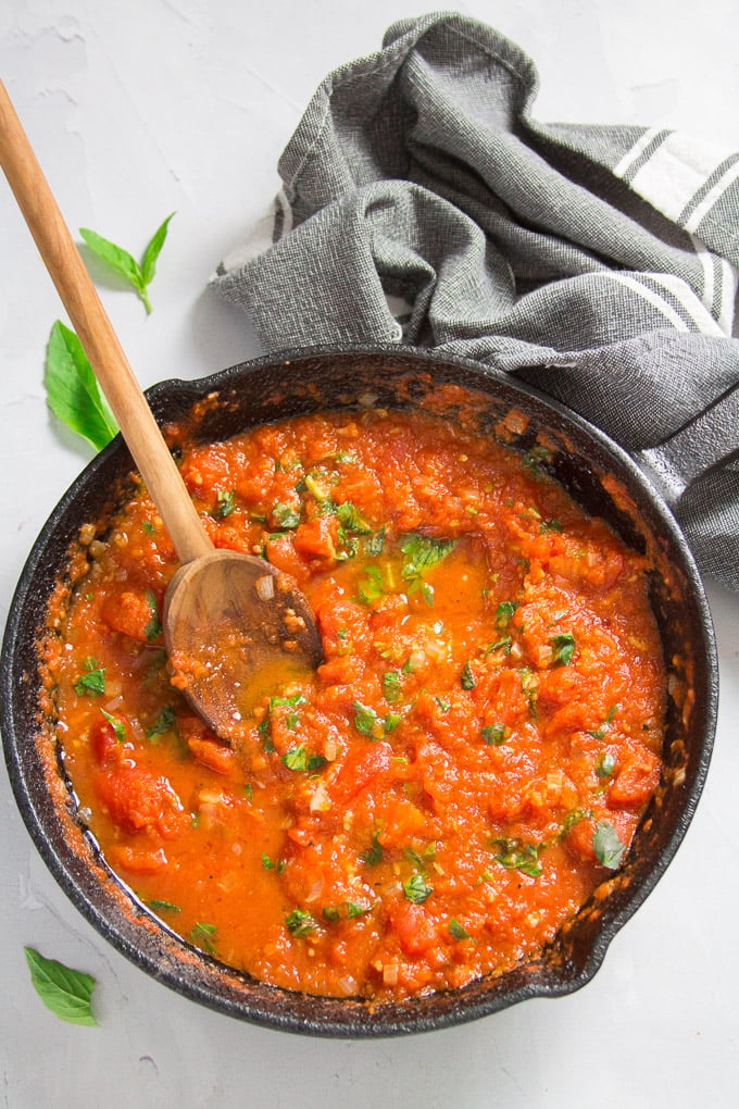 Skillet of Pomodoro Sauce with Wooden Spoon