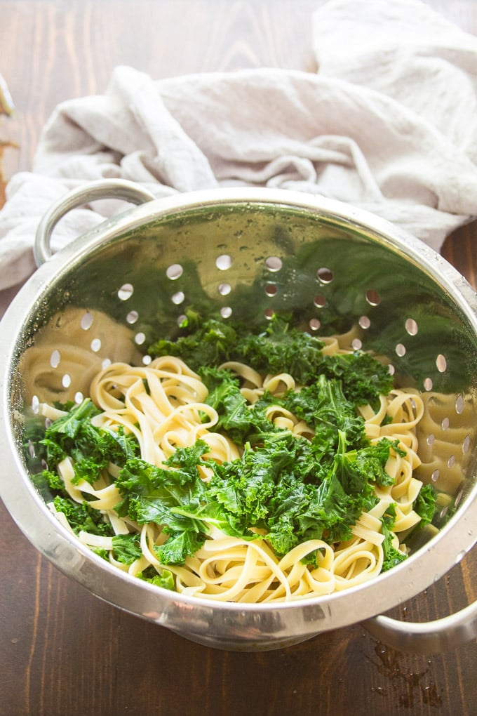 Pasta and Blanched Kale Draining in a Colander