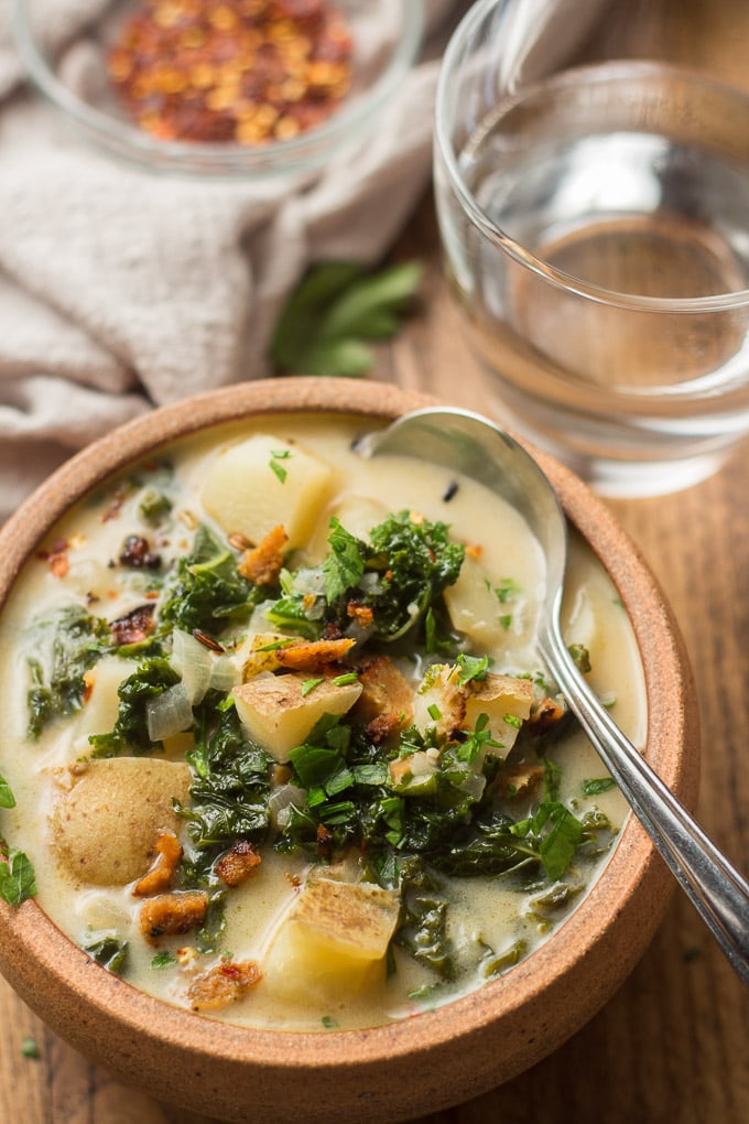 Close Up of Vegan Zuppa Toscana in a Bowl with Spoon