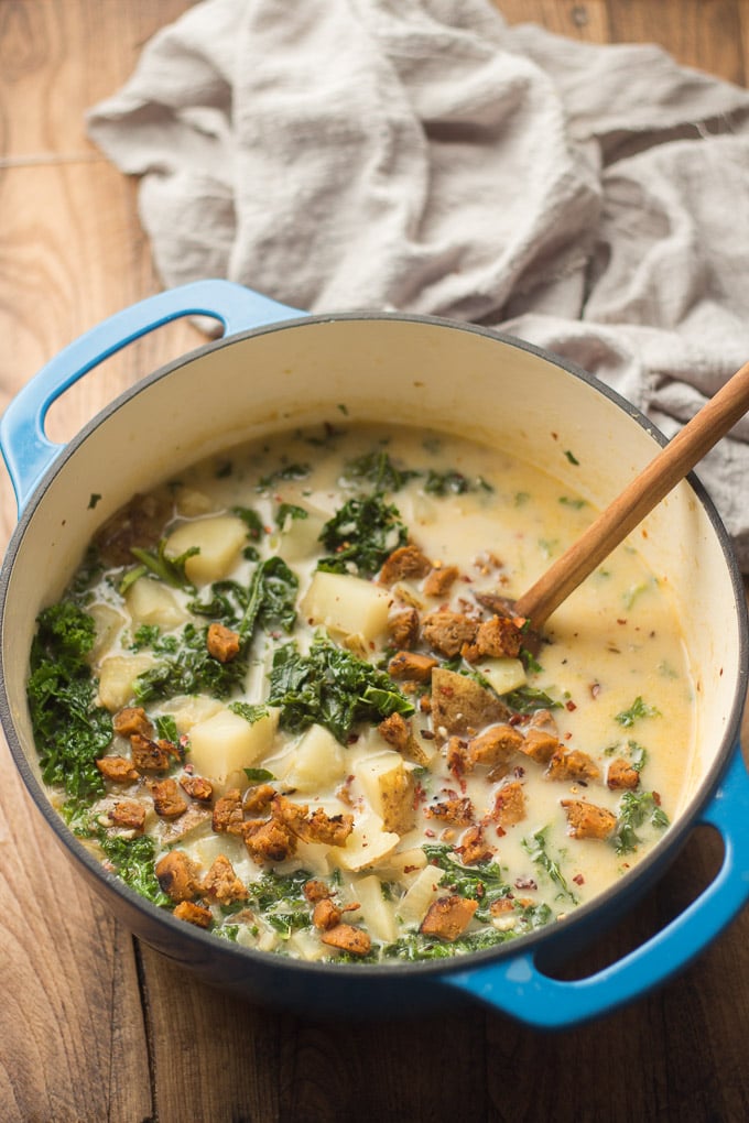 Pot of Vegan Zuppa Toscana with Wooden Spoon