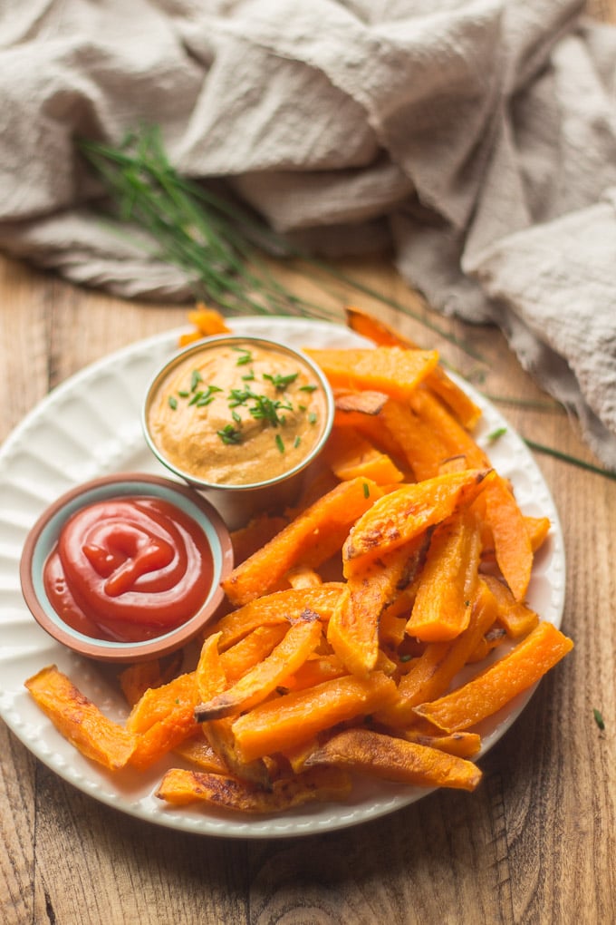 Plate of Butternut Squash Fries with Ketchup and Aioli, with Napkin and Chives in the Background