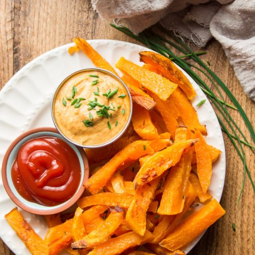 Place of Butternut Squash Fries on a Wooden Table