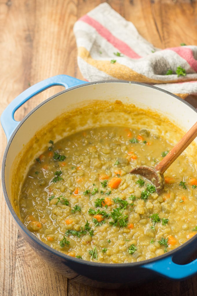Blue Pot Filled with Vegetarian Split Pea Soup with Wooden Spoon