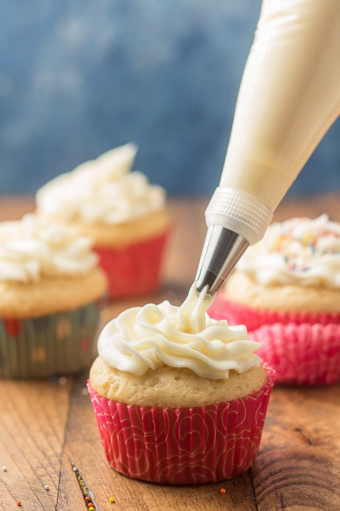 Vegan Vanilla Buttercream Frosting Being Piped onto a Cupcake