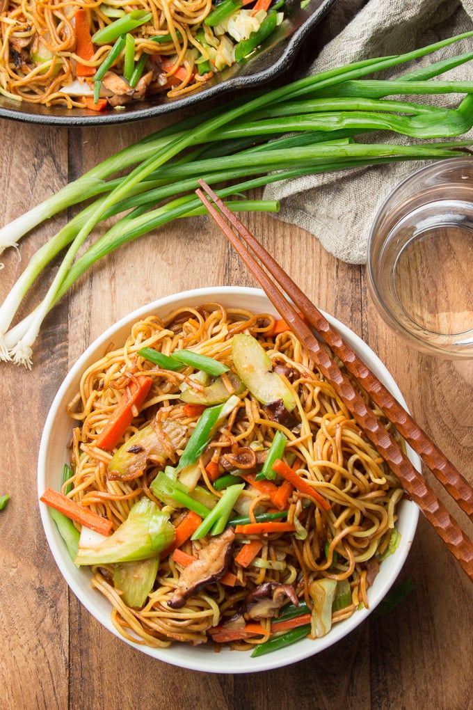 Bowl of Vegan Vegetable Chow Mein with Chopsticks Resting on Top