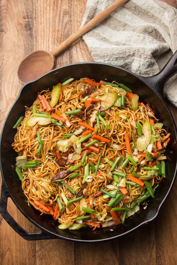 Cast Iron Skillet Filled with Vegetable Chow Mein on a Wooden Table