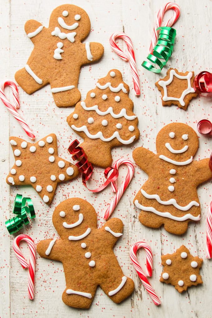 Vegan Gingerbread Cookies, Candy Canes and Ribbons on a Wooden Surface