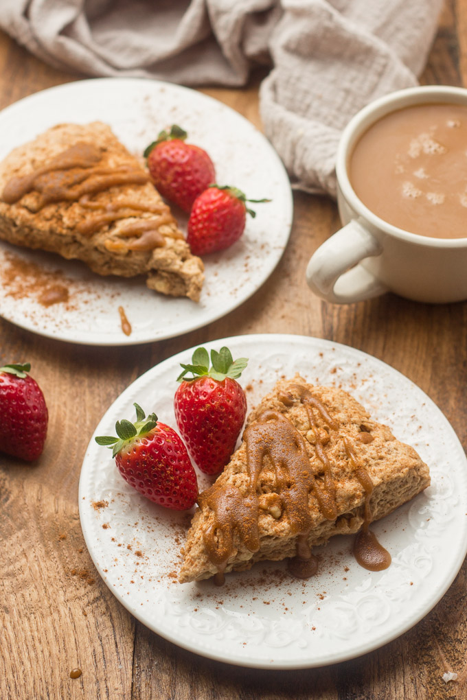 Two Vegan Brown Sugar Walnut Scones on Plates with Strawberries
