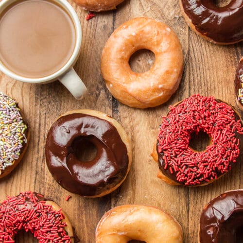 Vegan Doughnuts on a Wooden Surface with a Cup of Coffee