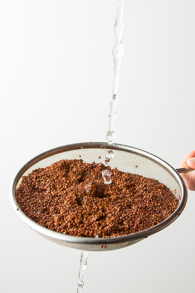 Water Rinsing Quinoa in a Mesh Strainer