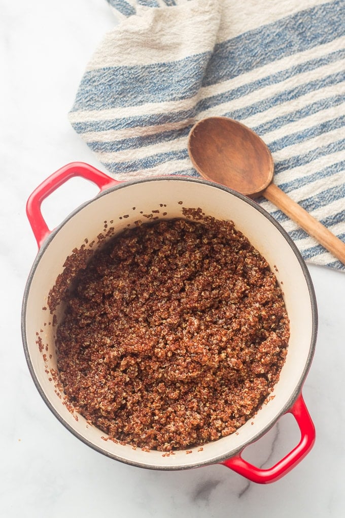 Pot of Quinoa with Napkin and Wooden Spoon
