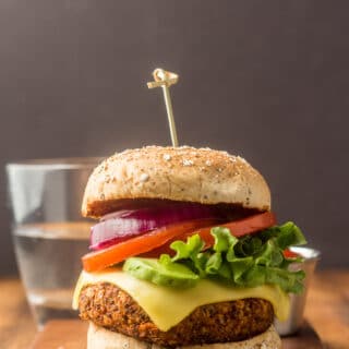 Quinoa Burger on a Bun with Vegan Cheese, Lettuce, Tomato, Avocado, and Onion