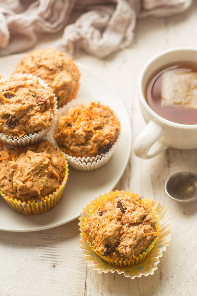 Vegan Carrot Muffins Arranged On a Table with a Cup of Tea
