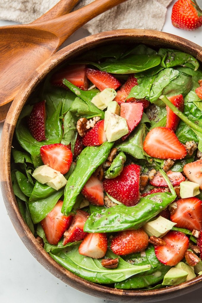 Close Up of Strawberry Spinach Salad in a Wooden Bowl